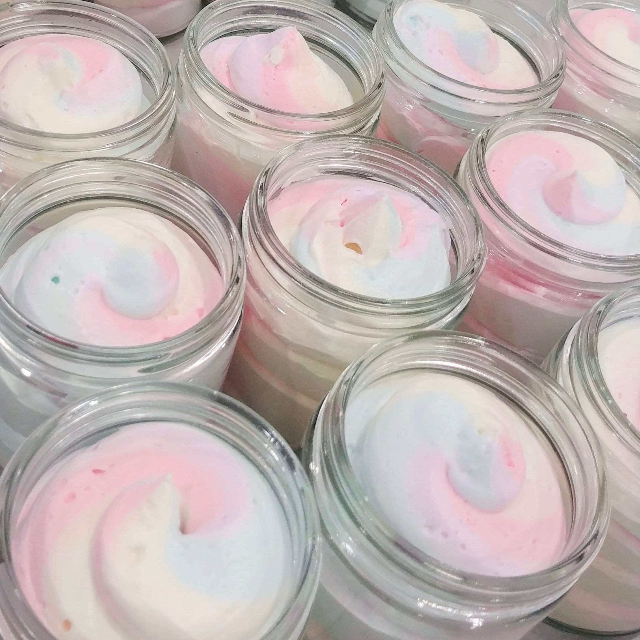 Butter Me Up Fruit Loops body butter in a jar, showcasing its creamy texture and vibrant packaging, perfect for moisturizing skin.