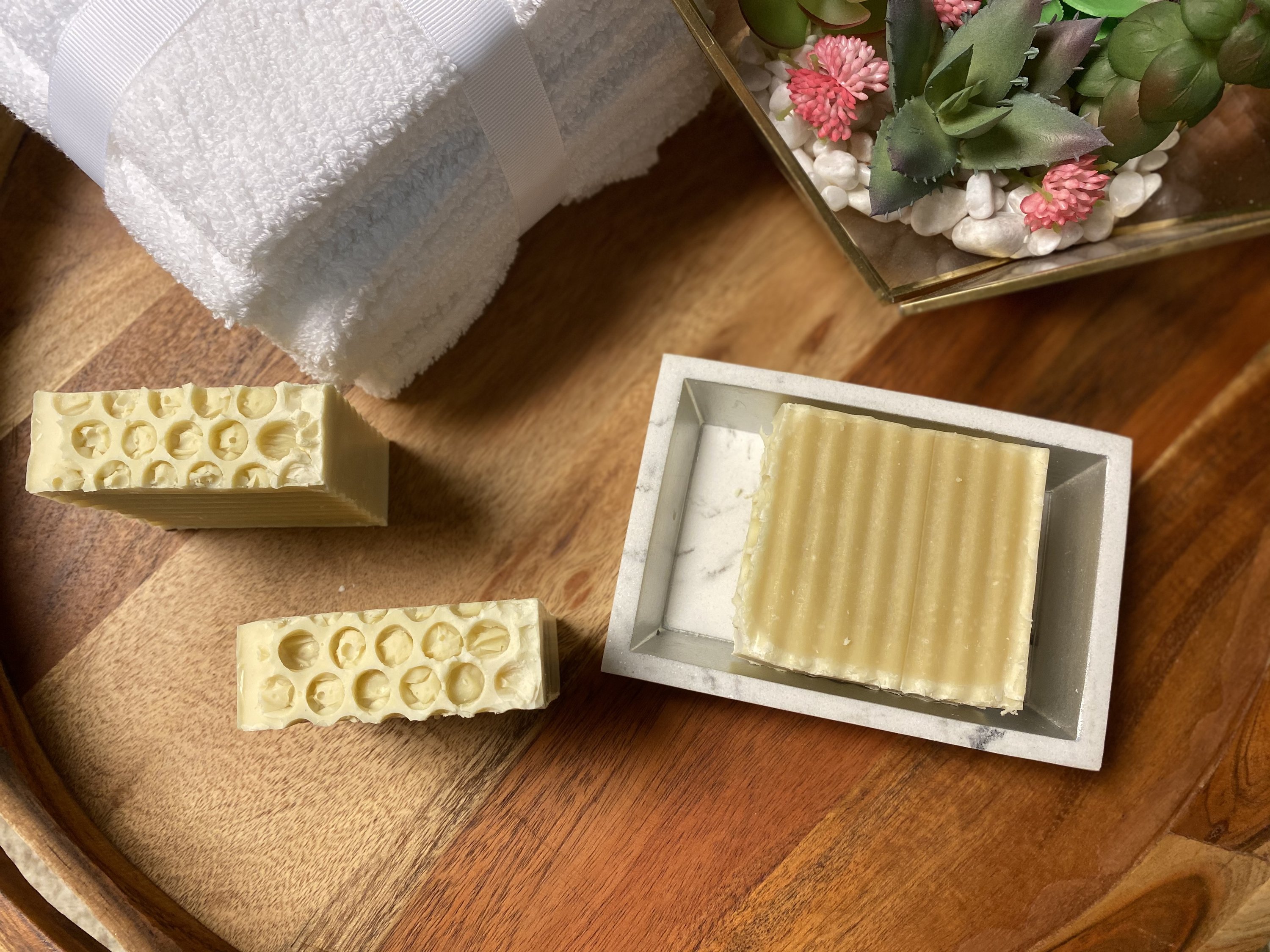 Buttermilk unscented soap bar with creamy texture, showcasing its natural ingredients and luxurious bubbles.