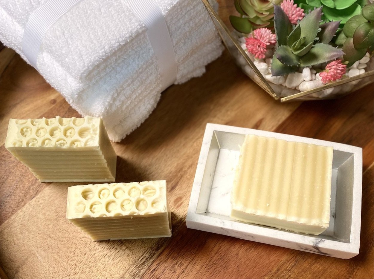 Buttermilk unscented soap bar with creamy texture, showcasing its natural ingredients and luxurious bubbles.