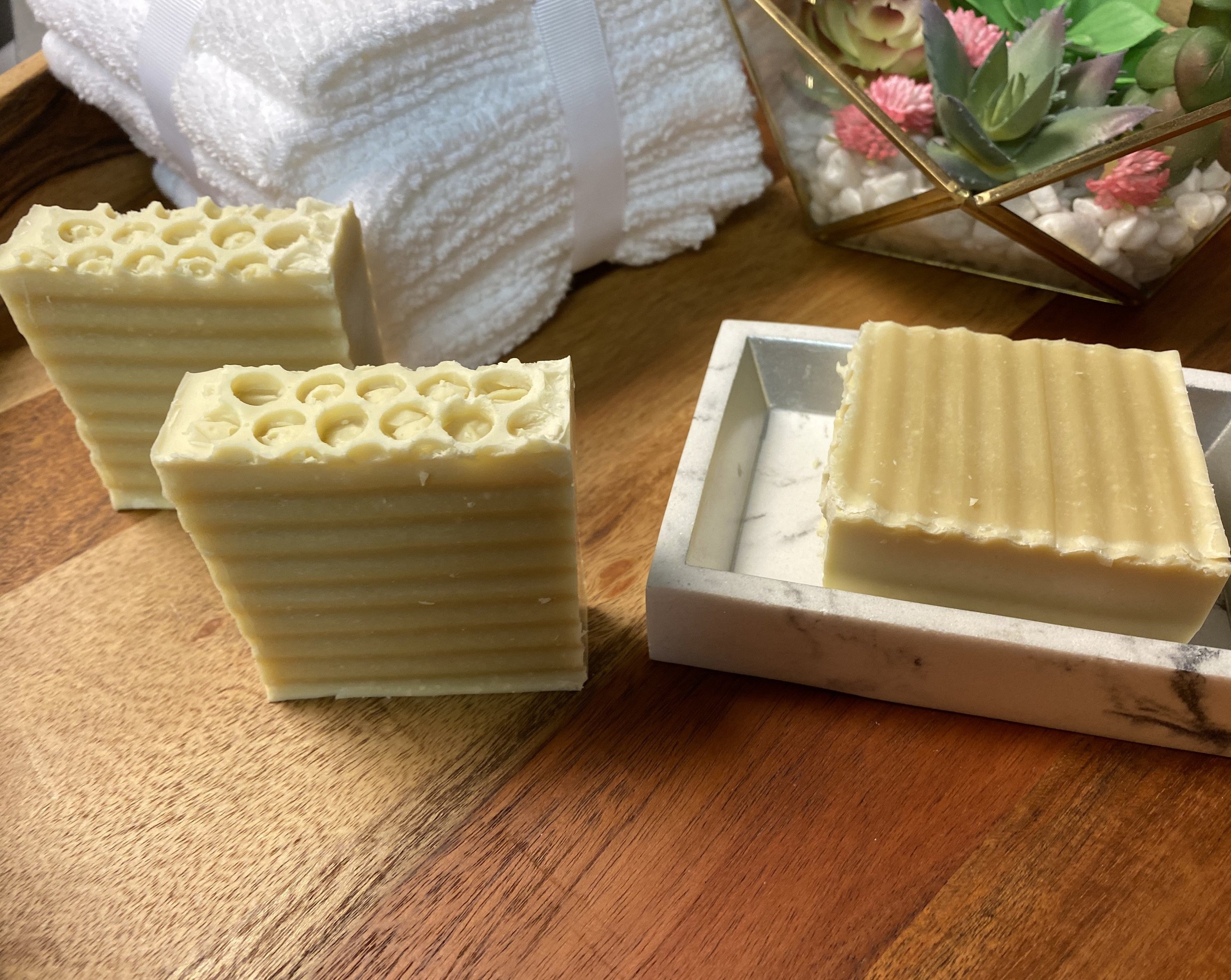 Buttermilk unscented soap bar with creamy texture, showcasing its natural ingredients and luxurious bubbles.