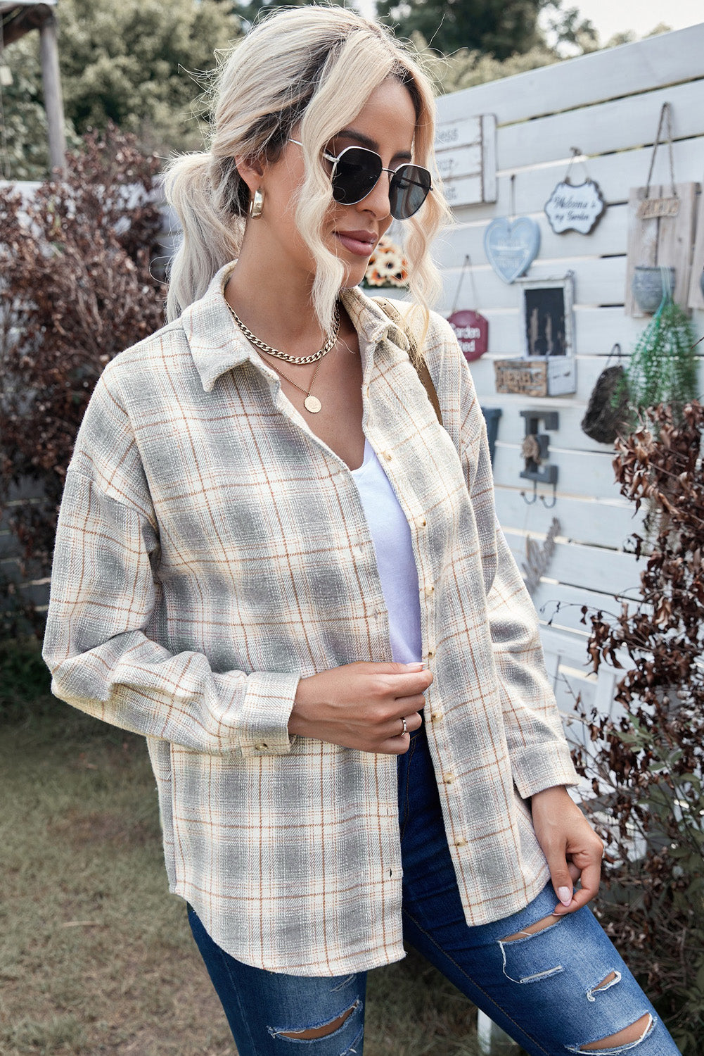 A stylish Buttoned Turn Down Collar Plaid Shirt featuring a slim fit design, classic plaid pattern, and button closure, suitable for ladies and young girls.