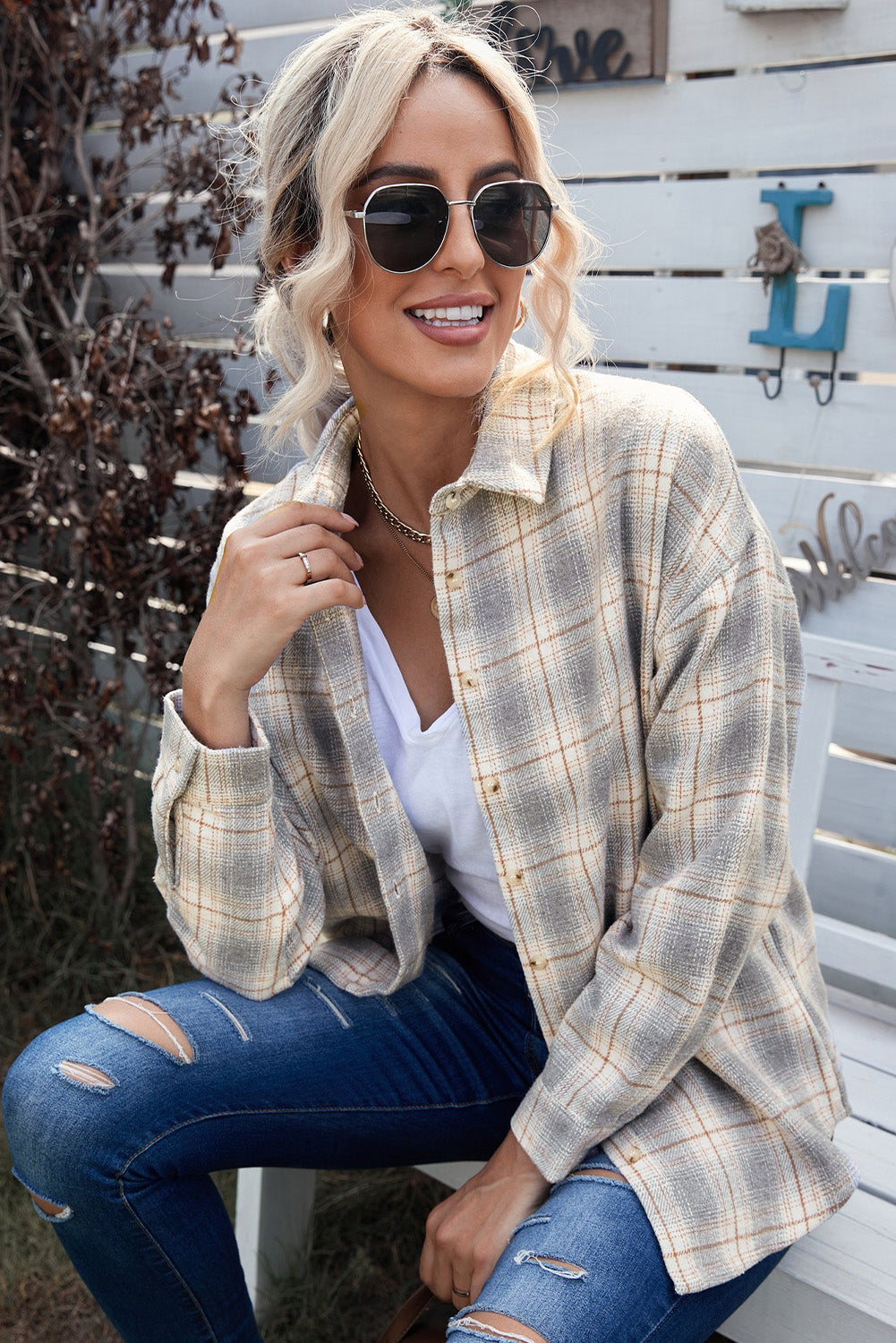 A stylish Buttoned Turn Down Collar Plaid Shirt featuring a slim fit design, classic plaid pattern, and button closure, suitable for ladies and young girls.