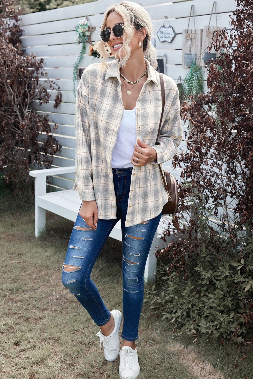 A stylish Buttoned Turn Down Collar Plaid Shirt featuring a slim fit design, classic plaid pattern, and button closure, suitable for ladies and young girls.