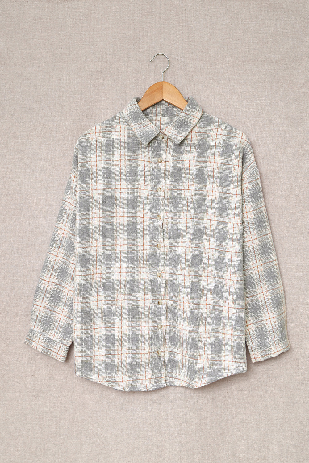 A stylish Buttoned Turn Down Collar Plaid Shirt featuring a slim fit design, classic plaid pattern, and button closure, suitable for ladies and young girls.