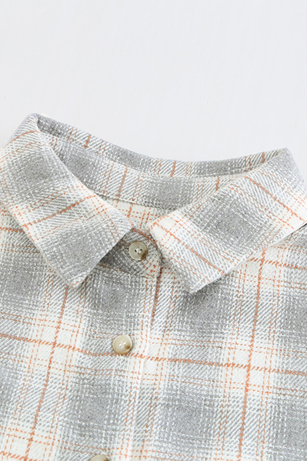 A stylish Buttoned Turn Down Collar Plaid Shirt featuring a slim fit design, classic plaid pattern, and button closure, suitable for ladies and young girls.