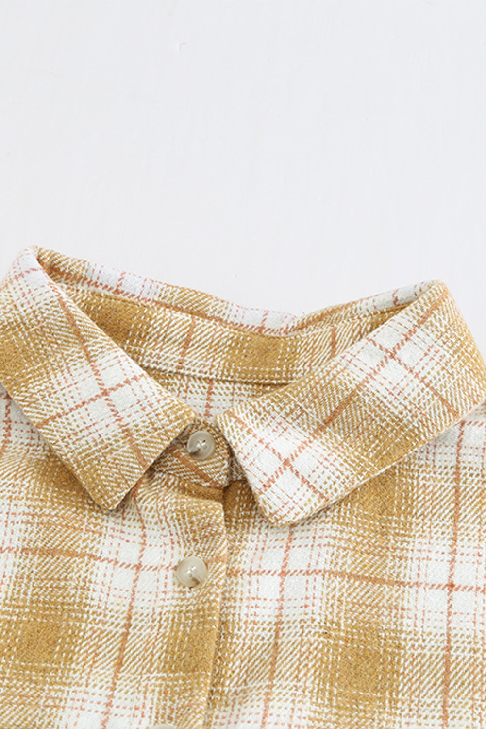 A stylish Buttoned Turn Down Collar Plaid Shirt featuring a slim fit design, classic plaid pattern, and button closure, suitable for ladies and young girls.