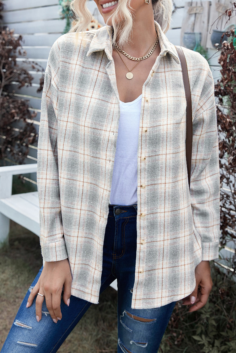 A stylish Buttoned Turn Down Collar Plaid Shirt featuring a slim fit design, classic plaid pattern, and button closure, suitable for ladies and young girls.