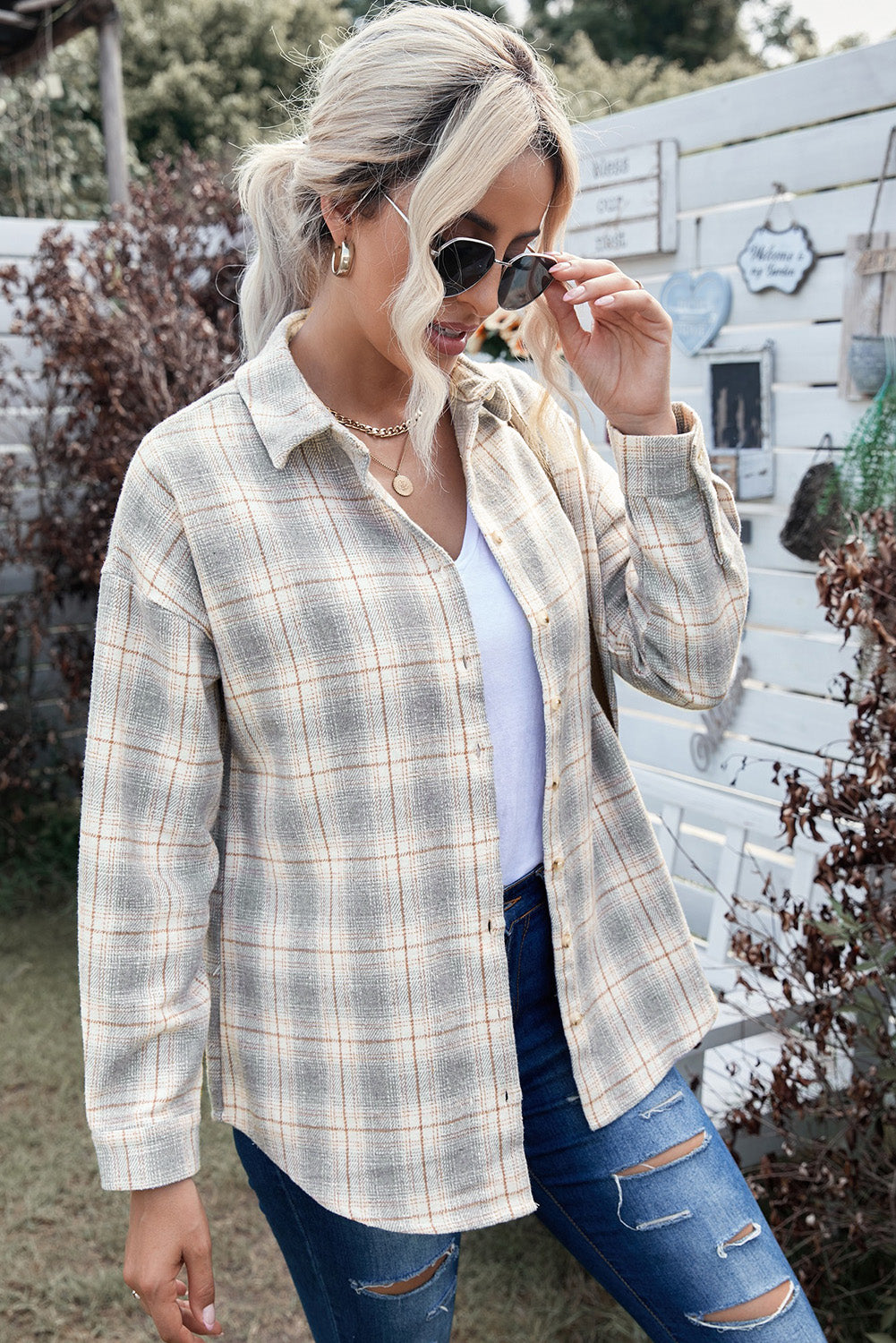 A stylish Buttoned Turn Down Collar Plaid Shirt featuring a slim fit design, classic plaid pattern, and button closure, suitable for ladies and young girls.