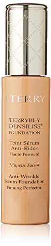 By Terry Terrybly Densiliss Wrinkle Control Serum Foundation in Light Amber shade, showcasing its elegant packaging and texture.