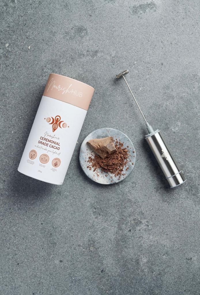 Cacao Ceremony Bundle featuring ceremonial grade cacao cylinder and stainless steel milk frother, perfect for rich, creamy cacao drinks.