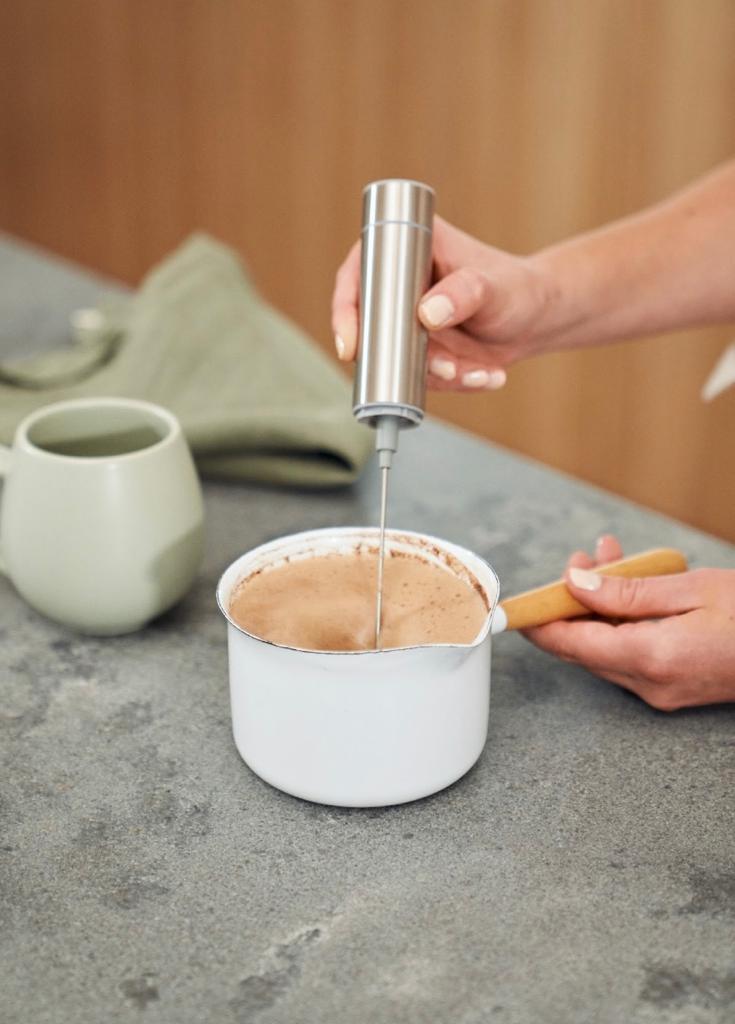 Cacao Ceremony Bundle featuring ceremonial grade cacao cylinder and stainless steel milk frother, perfect for rich, creamy cacao drinks.