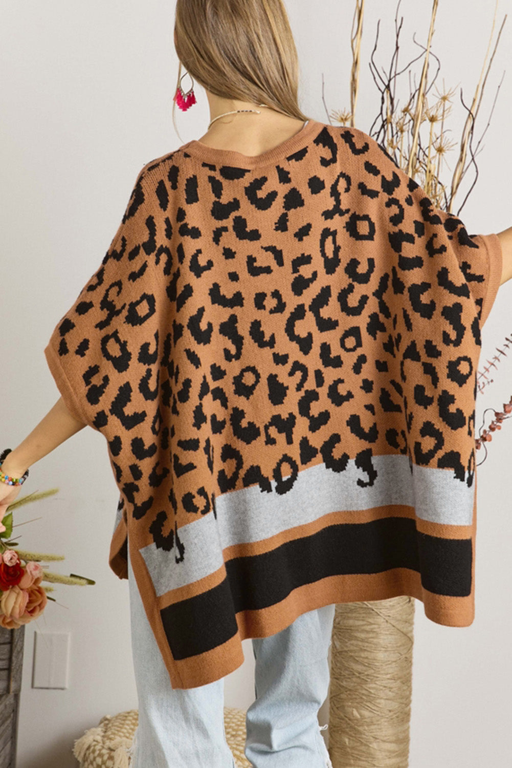 Camel leopard print poncho sweater with oversized fit and kimono sleeves, perfect for stylish cold weather outfits.