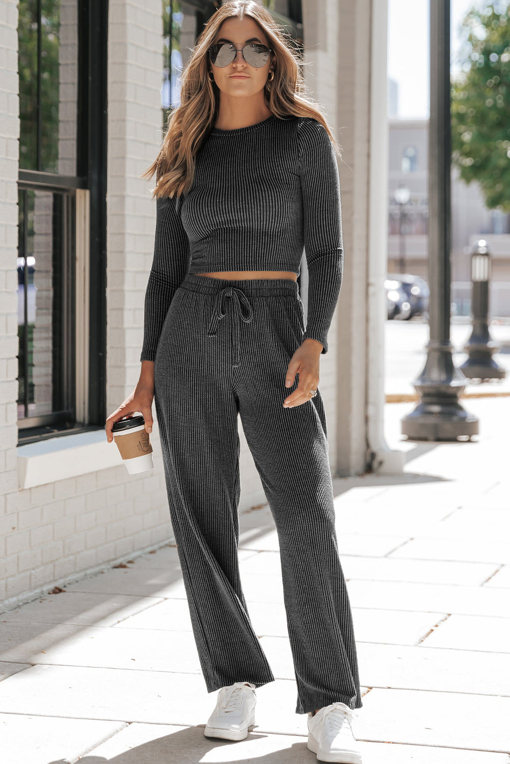 Carbon grey corded long sleeve top and wide leg pants set displayed on a mannequin, showcasing its relaxed fit and stylish design.