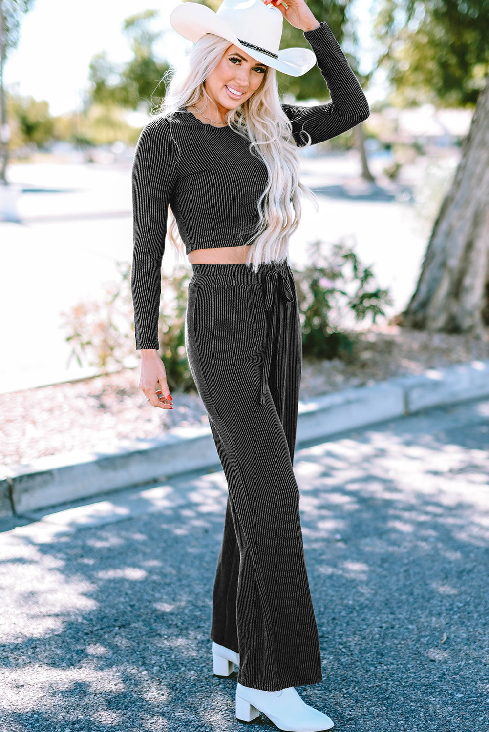 Carbon grey corded long sleeve top and wide leg pants set displayed on a mannequin, showcasing its relaxed fit and stylish design.