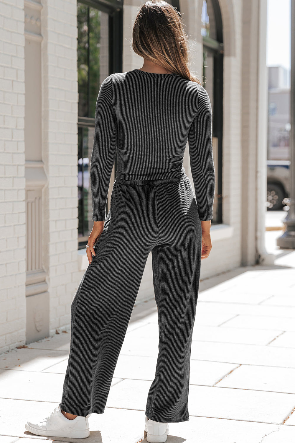 Carbon grey corded long sleeve top and wide leg pants set displayed on a mannequin, showcasing its relaxed fit and stylish design.