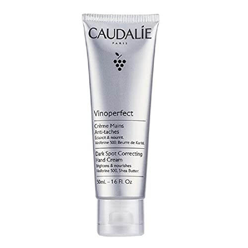 Caudalie Vinoperfect Dark Spot Correcting Hand Cream in a sleek tube, showcasing its elegant design and rich texture.