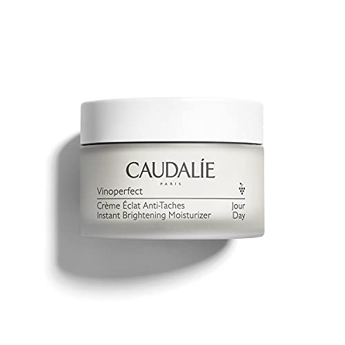 Caudalie Vinoperfect Instant Brightening Moisturizer in a sleek jar, showcasing its creamy texture and elegant packaging.