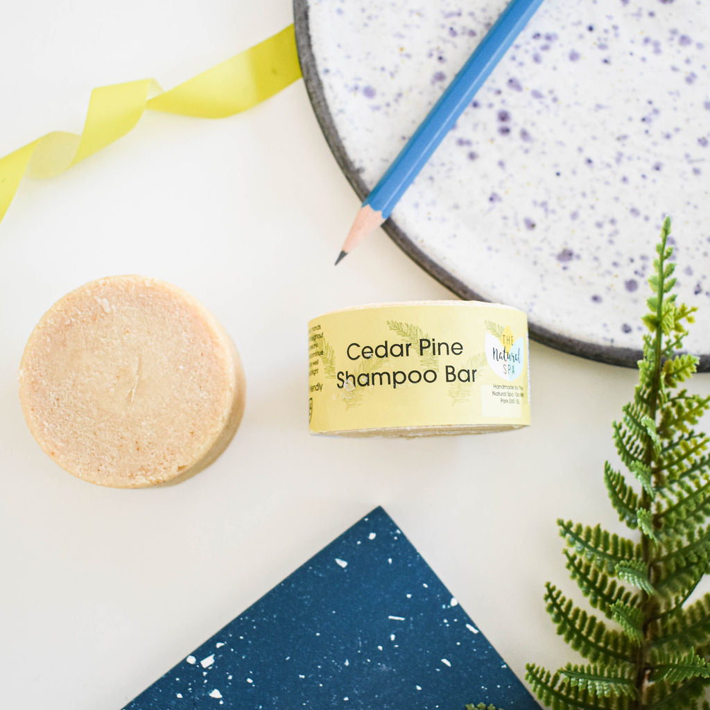 Cedarwood and Pine Shampoo Bar, a plastic-free solid shampoo with natural ingredients, displayed on a wooden surface.