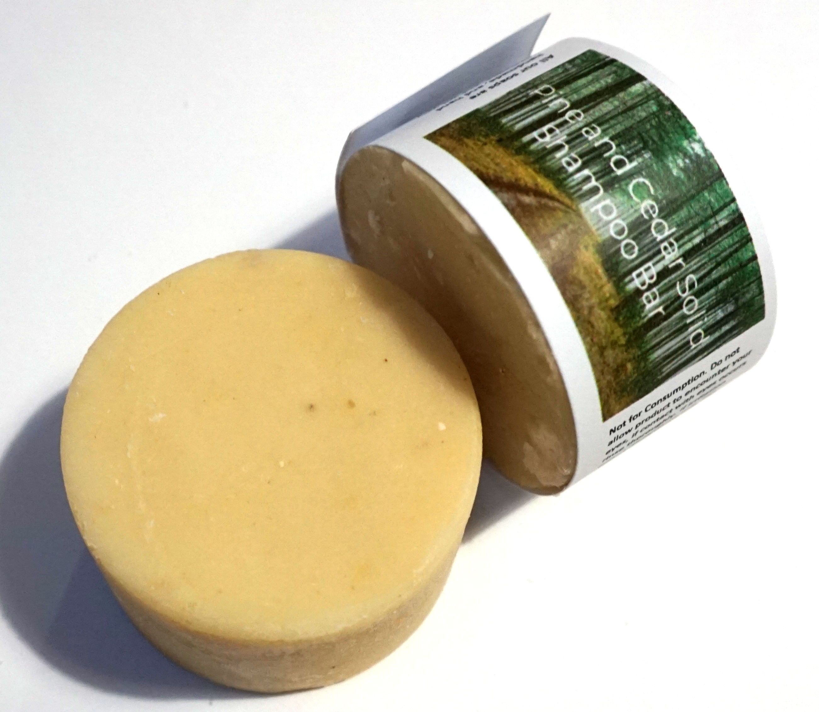 Cedarwood and Pine Shampoo Bar, a plastic-free solid shampoo with natural ingredients, displayed on a wooden surface.