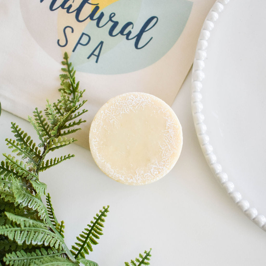 Cedarwood and Pine Shampoo Bar, a plastic-free solid shampoo with natural ingredients, displayed on a wooden surface.