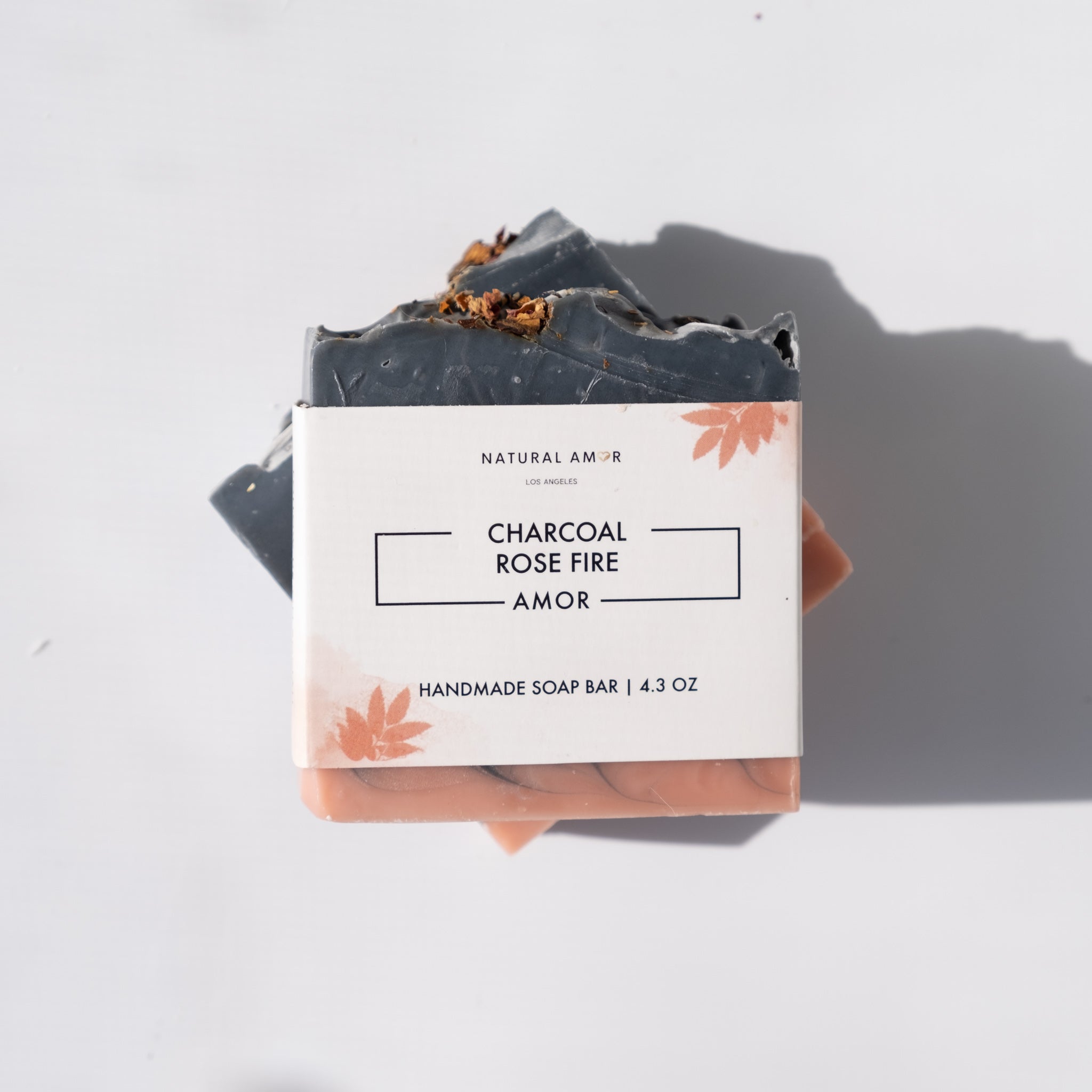 Charcoal Cedar Rose Soap Bar with rose petals and cedar wood, showcasing its rich texture and natural ingredients.