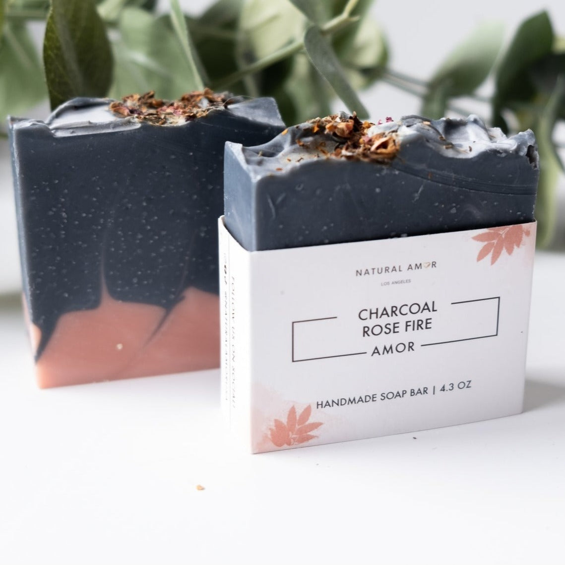 Charcoal Cedar Rose Soap Bar with rose petals and cedar wood, showcasing its rich texture and natural ingredients.