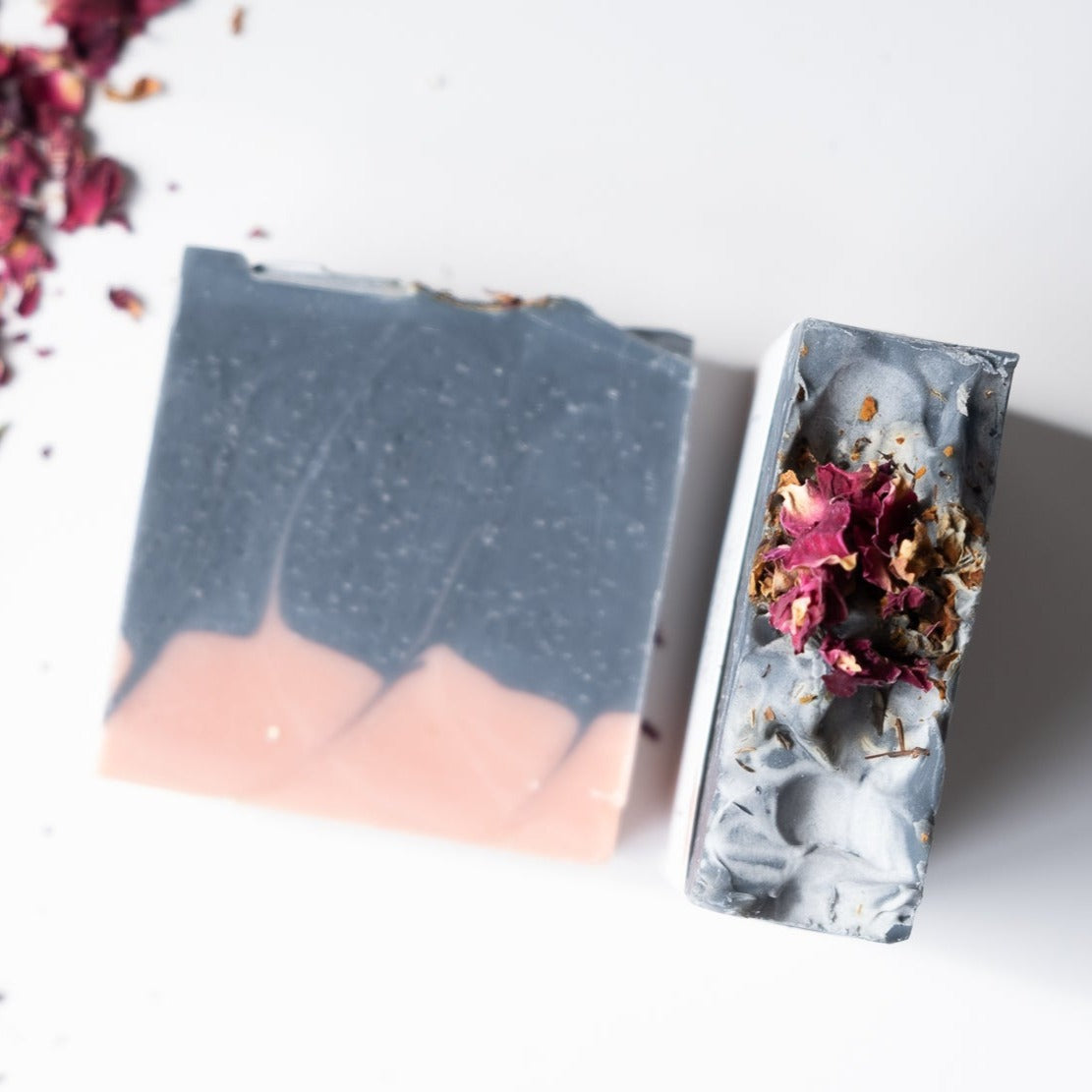 Charcoal Cedar Rose Soap Bar with rose petals and cedar wood, showcasing its rich texture and natural ingredients.