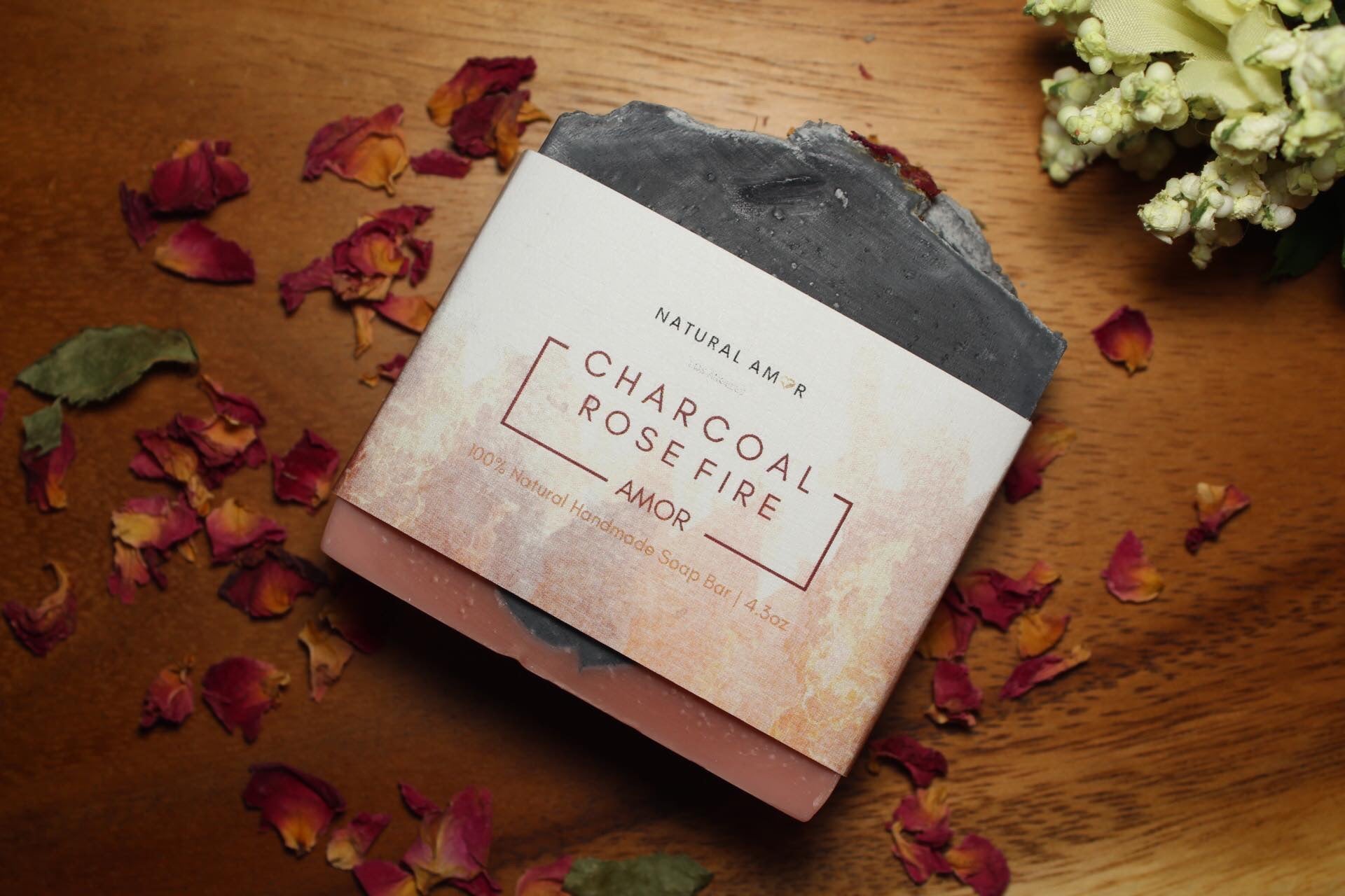 Charcoal Cedar Rose Soap Bar with rose petals and cedar wood, showcasing its rich texture and natural ingredients.