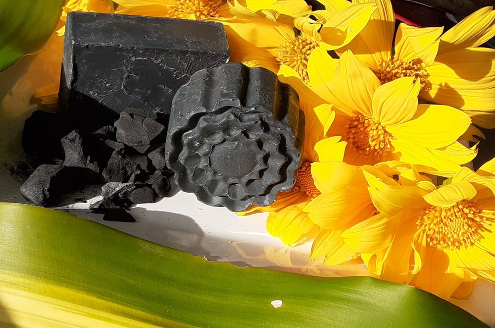 Charcoal Swirl Bath Soap with a unique swirl design, showcasing its rich texture and dark charcoal color.