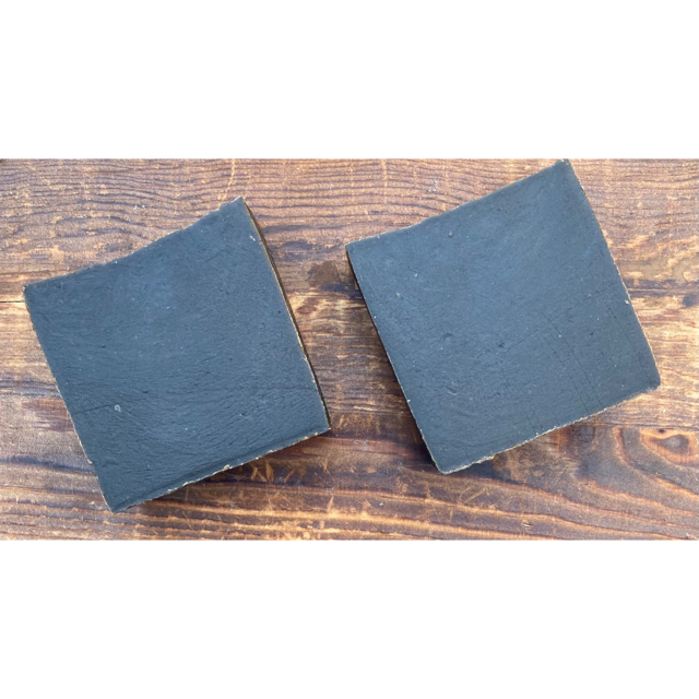 A bar of Activated Charcoal and Turmeric Soap showcasing its rich texture and natural ingredients, ideal for oily and acne-prone skin.