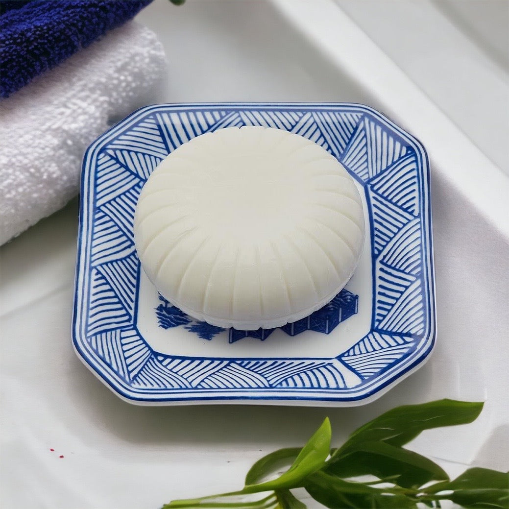 Chinoiserie Soap & Dish Set featuring a sandalwood scented soap on a blue and white porcelain tray, elegantly embossed design.