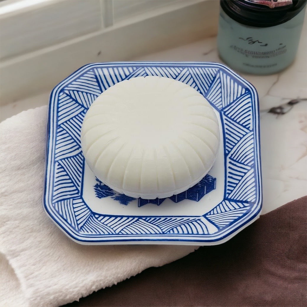 Chinoiserie Soap & Dish Set featuring a sandalwood scented soap on a blue and white porcelain tray, elegantly embossed design.