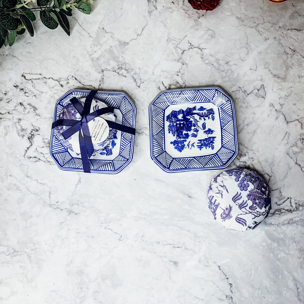 Chinoiserie Soap & Dish Set featuring a sandalwood scented soap on a blue and white porcelain tray, elegantly embossed design.