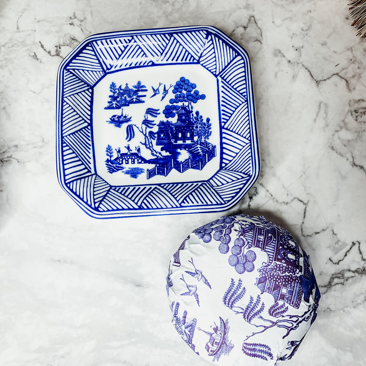 Chinoiserie Soap & Dish Set featuring a sandalwood scented soap on a blue and white porcelain tray, elegantly embossed design.