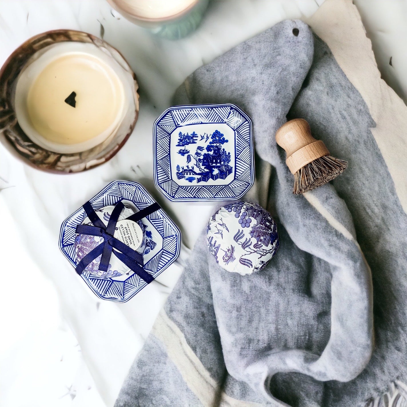 Chinoiserie Soap & Dish Set featuring a sandalwood scented soap on a blue and white porcelain tray, elegantly embossed design.