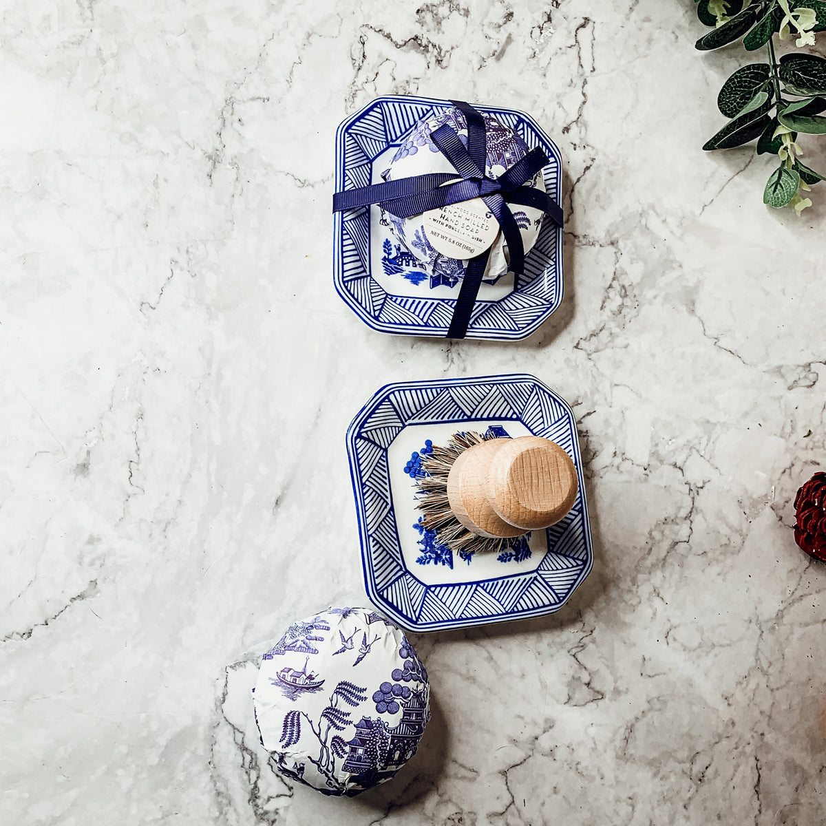 Chinoiserie Soap & Dish Set featuring a sandalwood scented soap on a blue and white porcelain tray, elegantly embossed design.