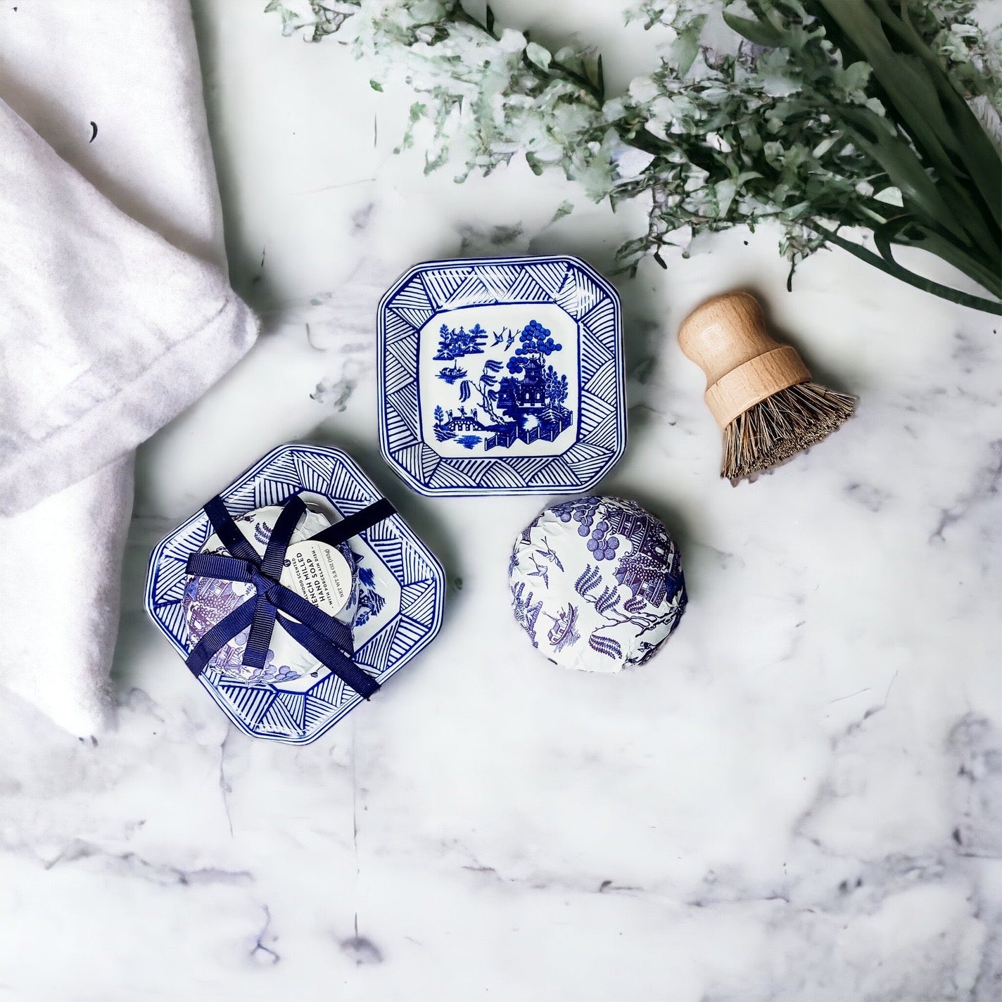 Chinoiserie Soap & Dish Set featuring a sandalwood scented soap on a blue and white porcelain tray, elegantly embossed design.