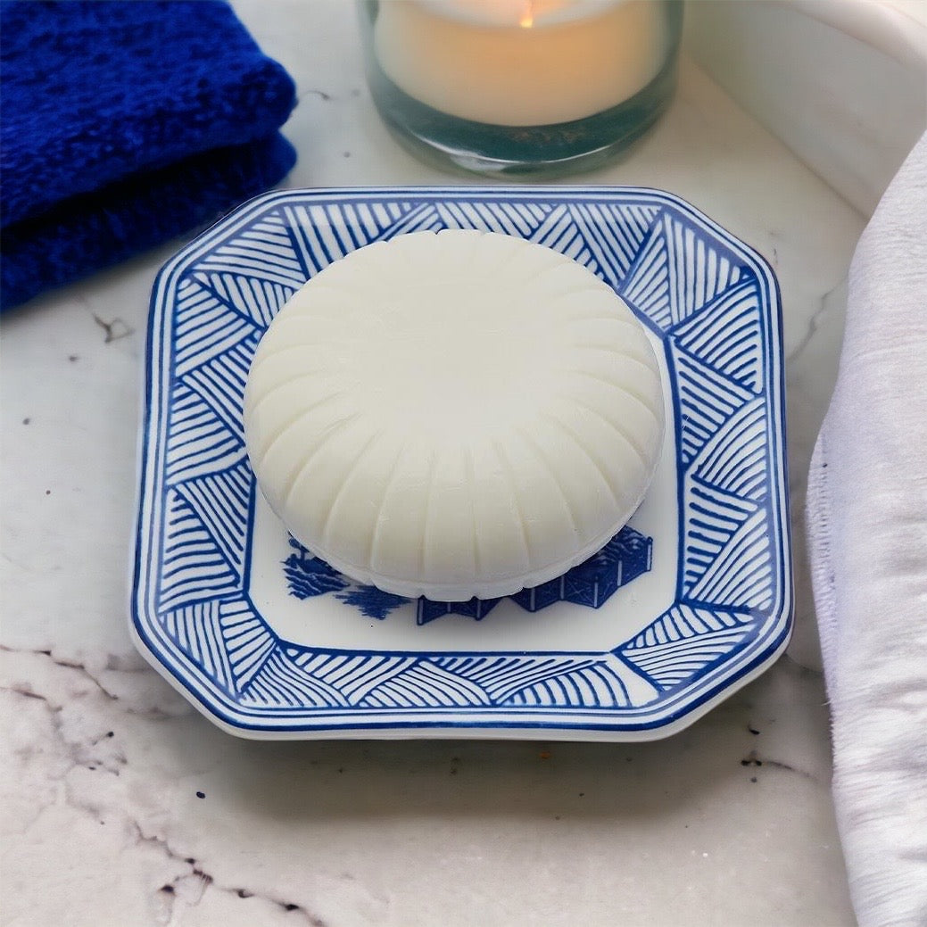 Chinoiserie Soap & Dish Set featuring a sandalwood scented soap on a blue and white porcelain tray, elegantly embossed design.