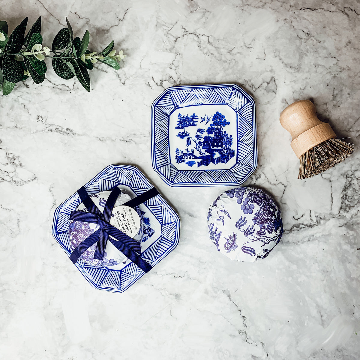 Chinoiserie Soap & Dish Set featuring a sandalwood scented soap on a blue and white porcelain tray, elegantly embossed design.