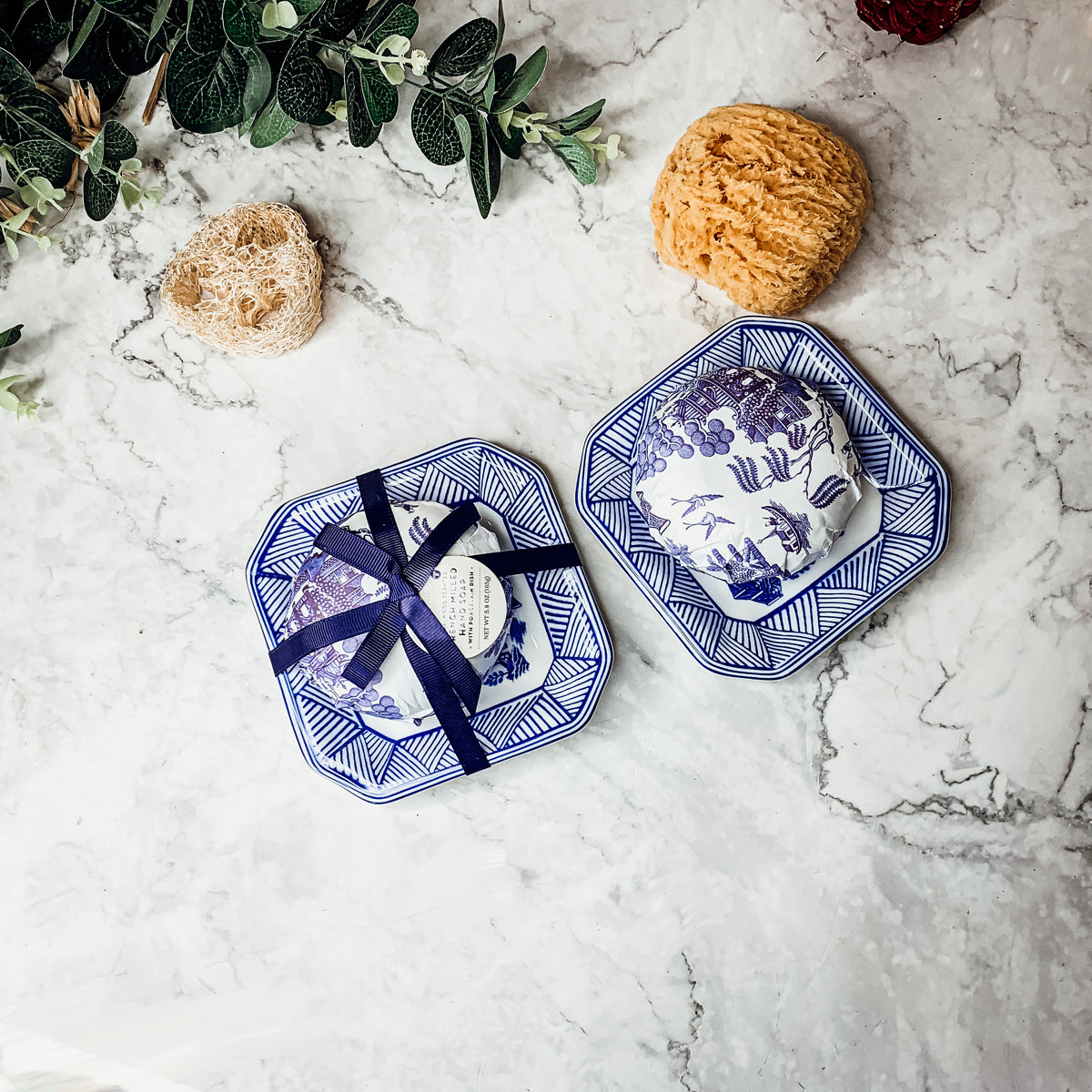 Chinoiserie Soap & Dish Set featuring a sandalwood scented soap on a blue and white porcelain tray, elegantly embossed design.