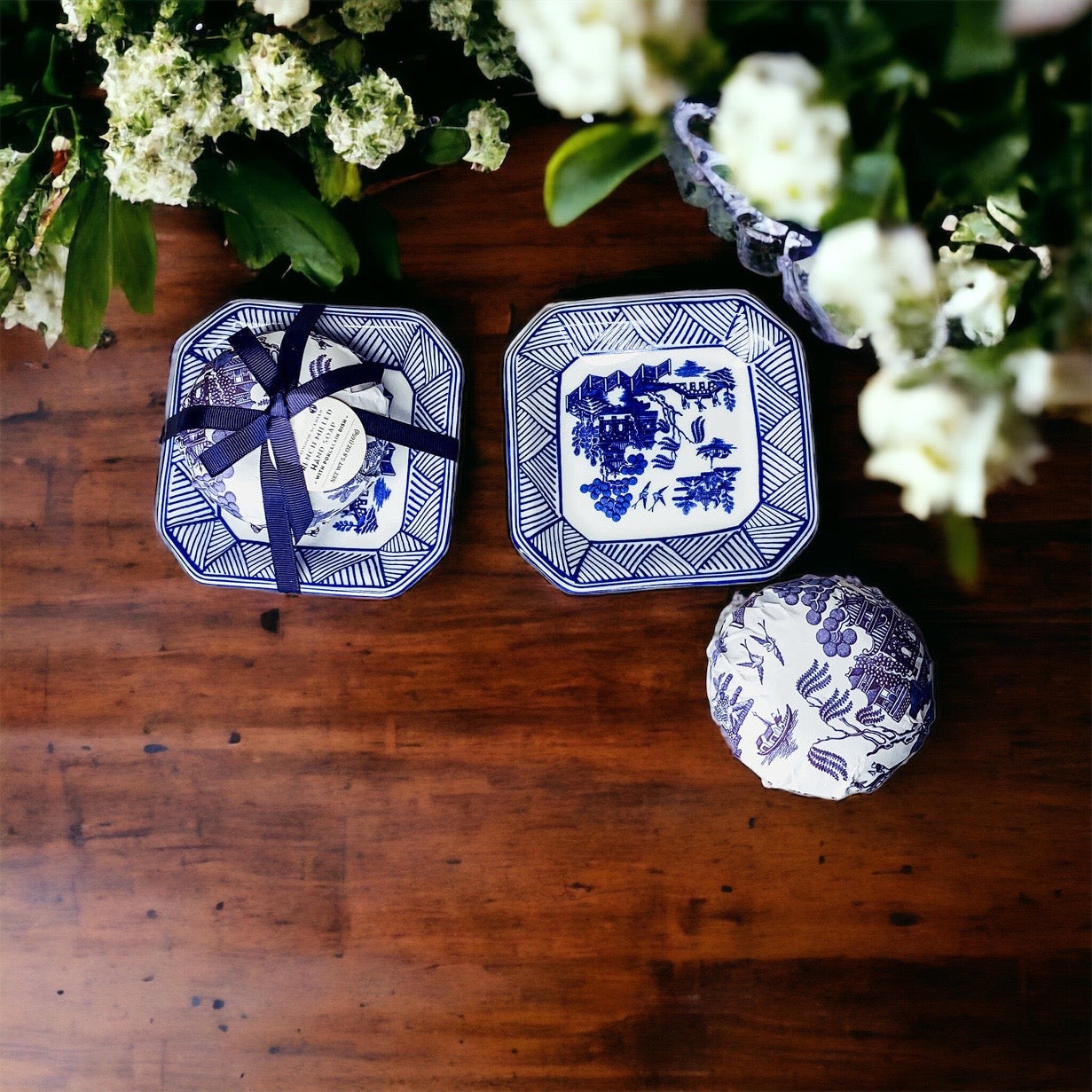 Chinoiserie Soap & Dish Set featuring a sandalwood scented soap on a blue and white porcelain tray, elegantly embossed design.