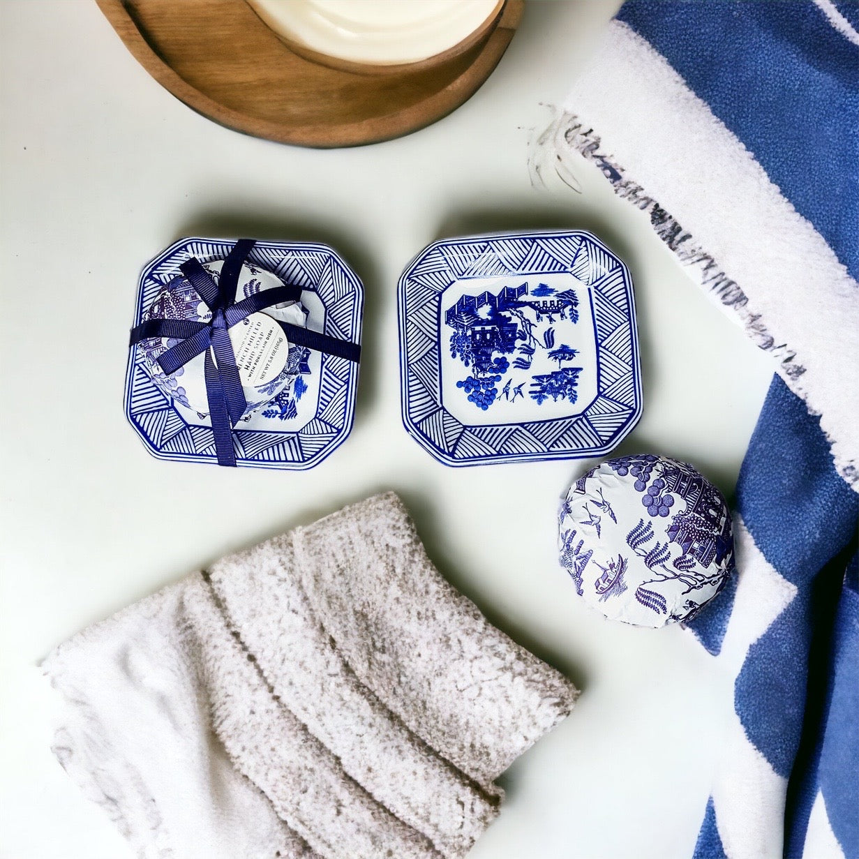 Chinoiserie Soap & Dish Set featuring a sandalwood scented soap on a blue and white porcelain tray, elegantly embossed design.