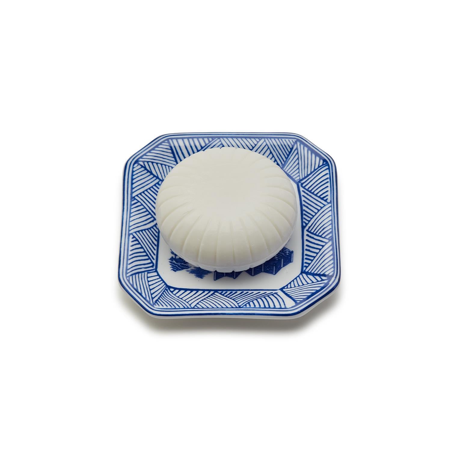 Chinoiserie Soap & Dish Set featuring a sandalwood scented soap on a blue and white porcelain tray, elegantly embossed design.