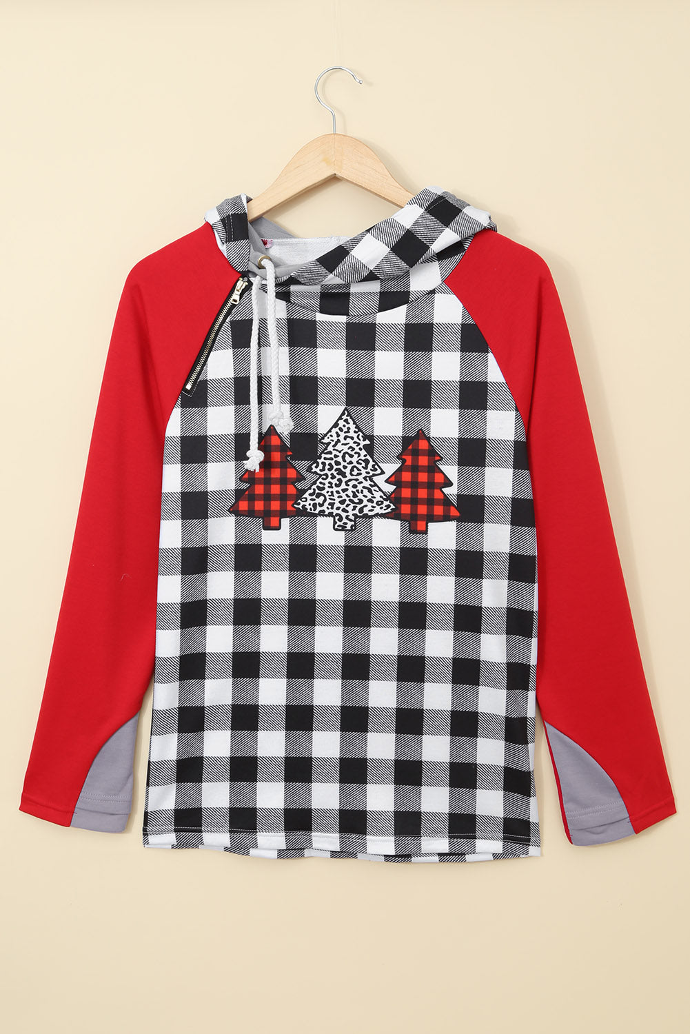 A cozy red plaid asymmetric zip hoodie featuring a Christmas tree print on the chest, perfect for festive occasions.