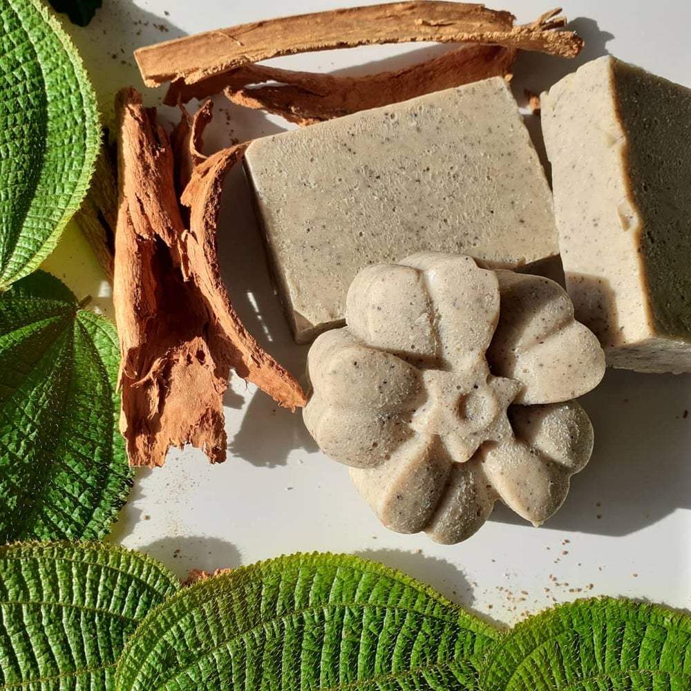 A bar of handmade Cinnamon Bath Soap with a rich brown color, showcasing its organic ingredients and natural texture.