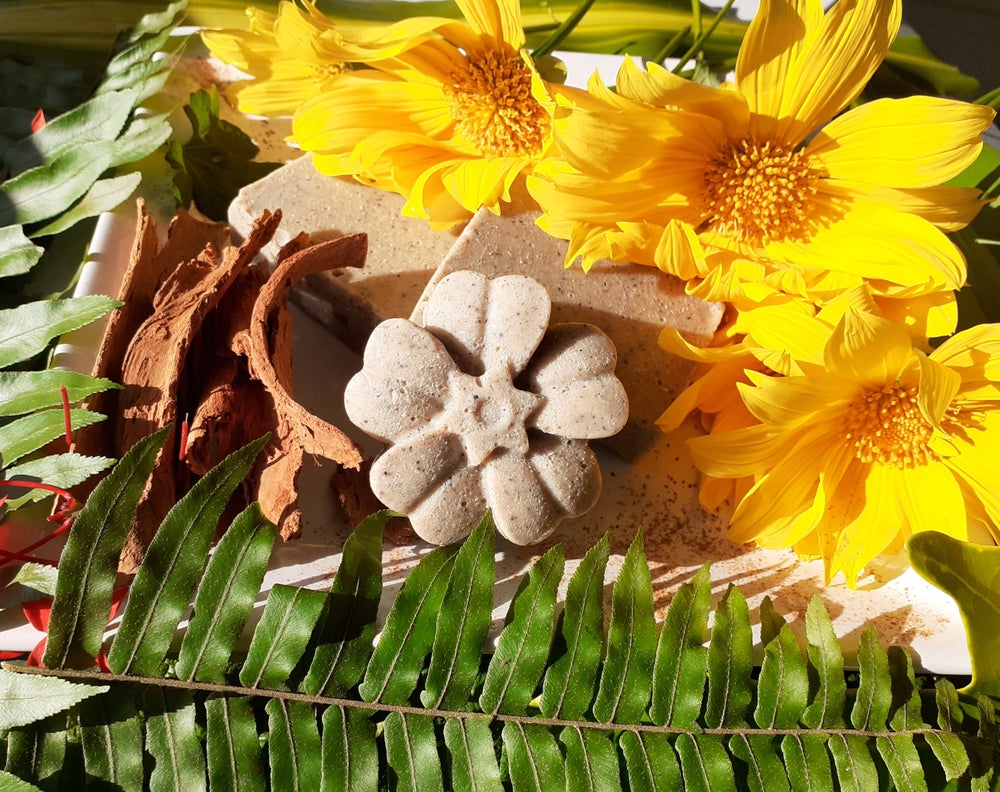 A bar of handmade Cinnamon Bath Soap with a rich brown color, showcasing its organic ingredients and natural texture.