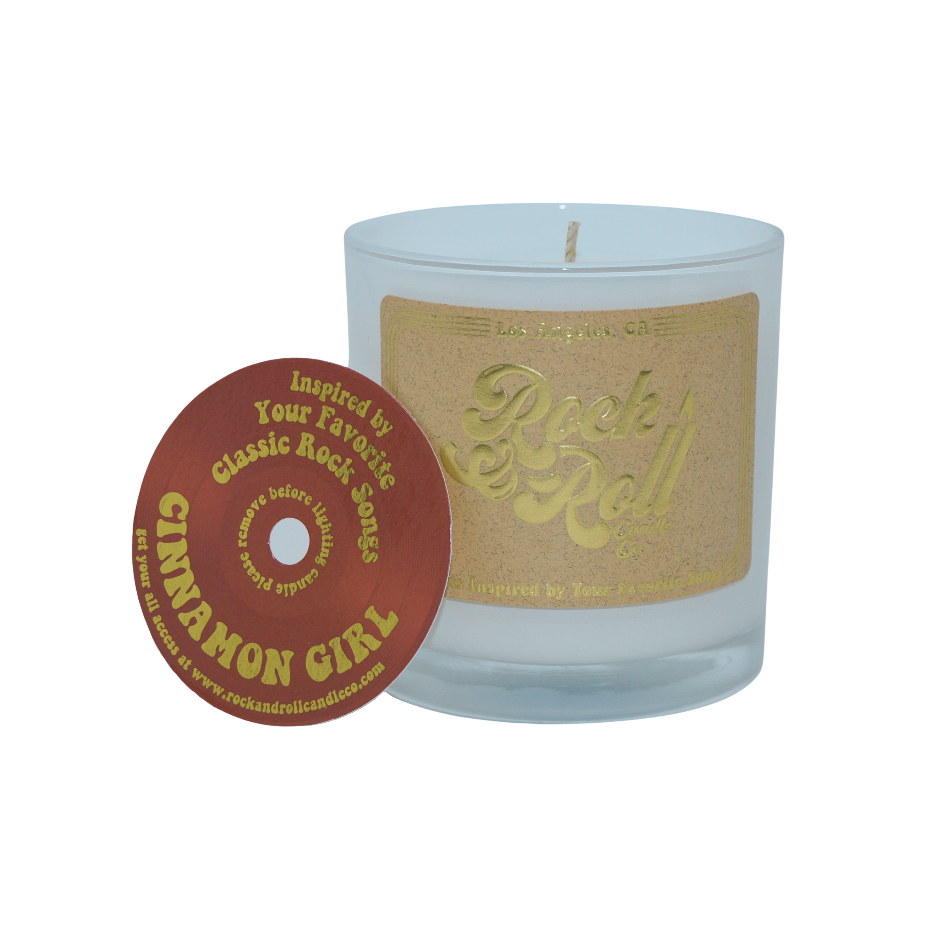 Cinnamon Girl candle featuring a warm apple-cinnamon scent in a stylish 10oz container made from eco-friendly coconut wax.