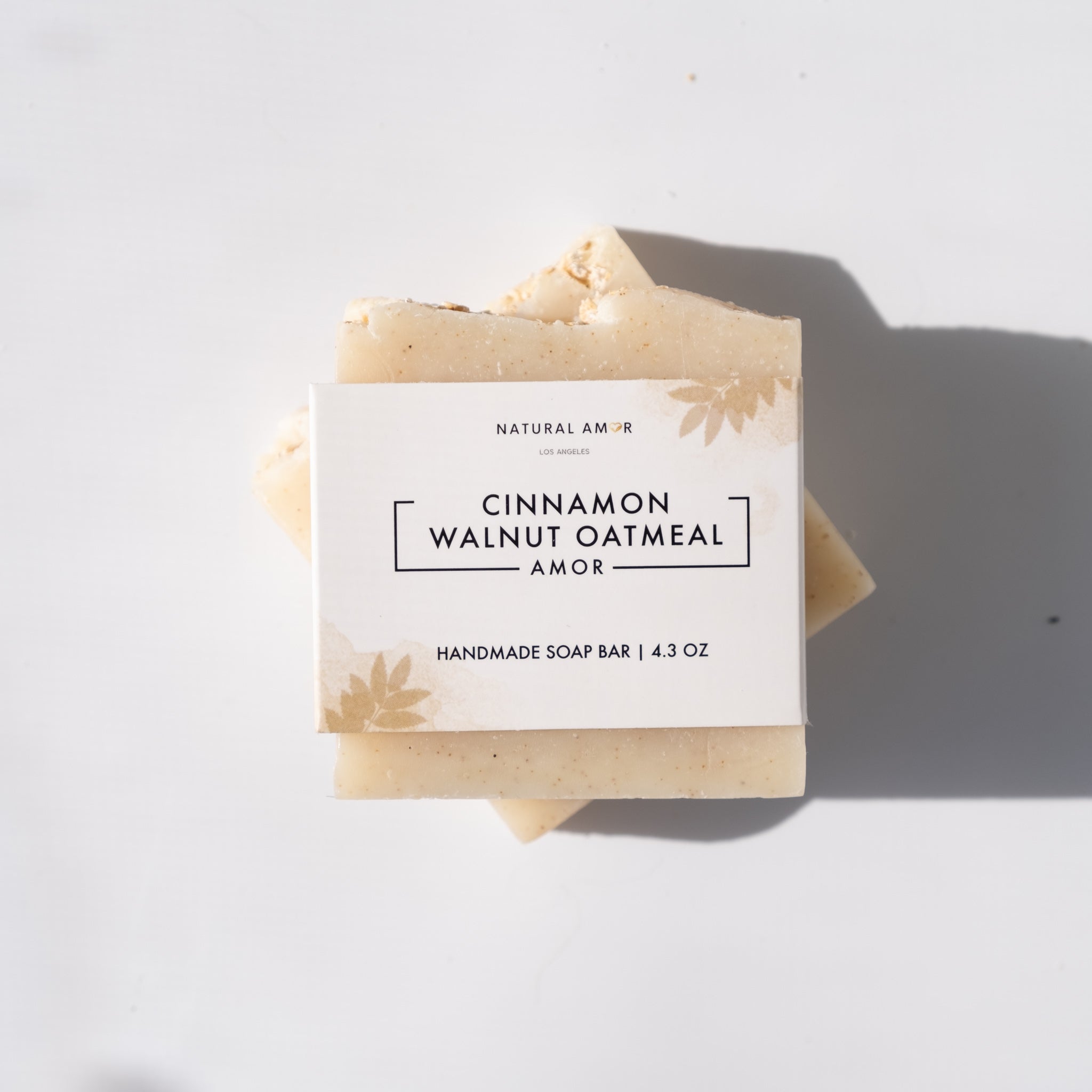 Cinnamon Walnut Oatmeal Soap Bar with natural ingredients, showcasing its rich texture and warm colors.