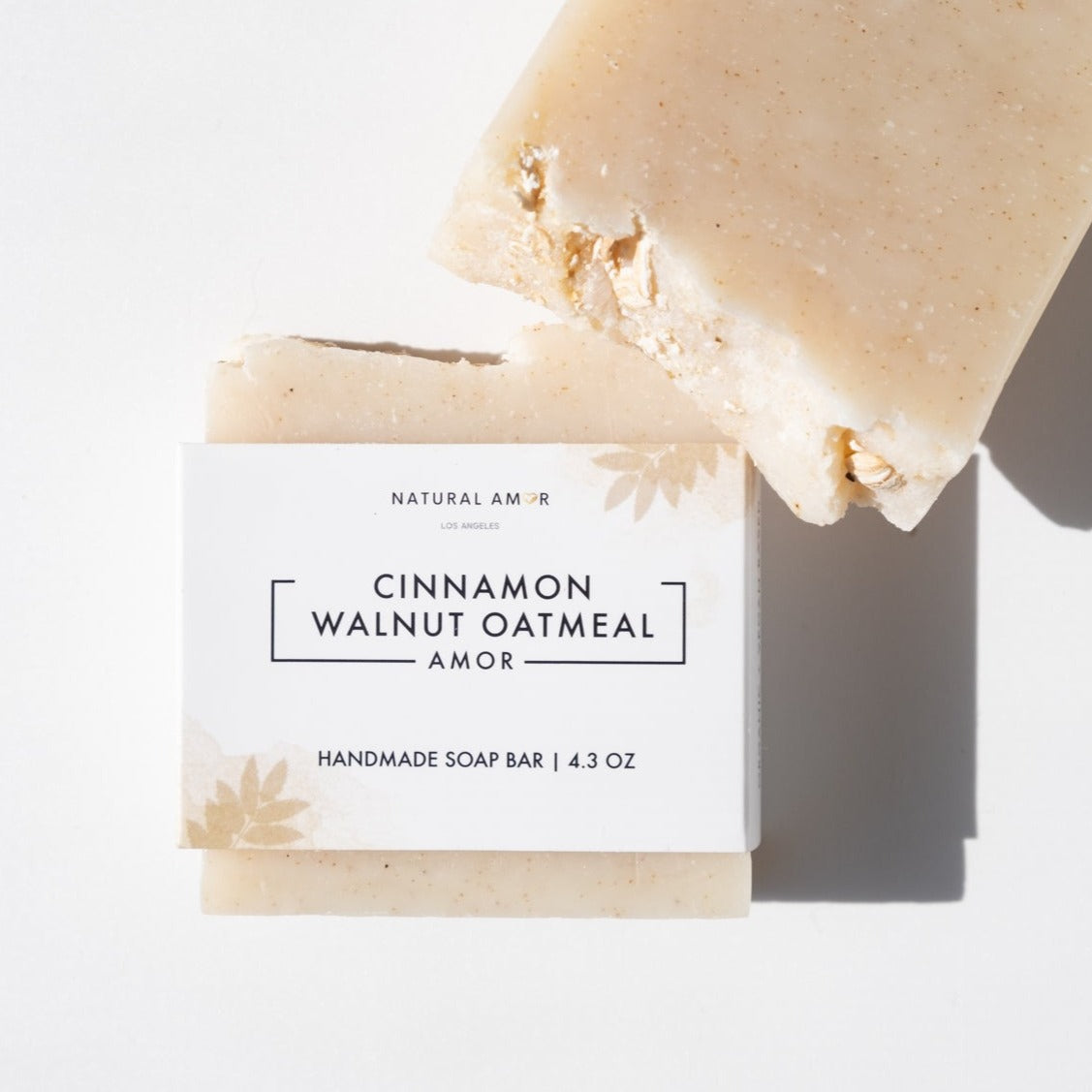 Cinnamon Walnut Oatmeal Soap Bar with natural ingredients, showcasing its rich texture and warm colors.