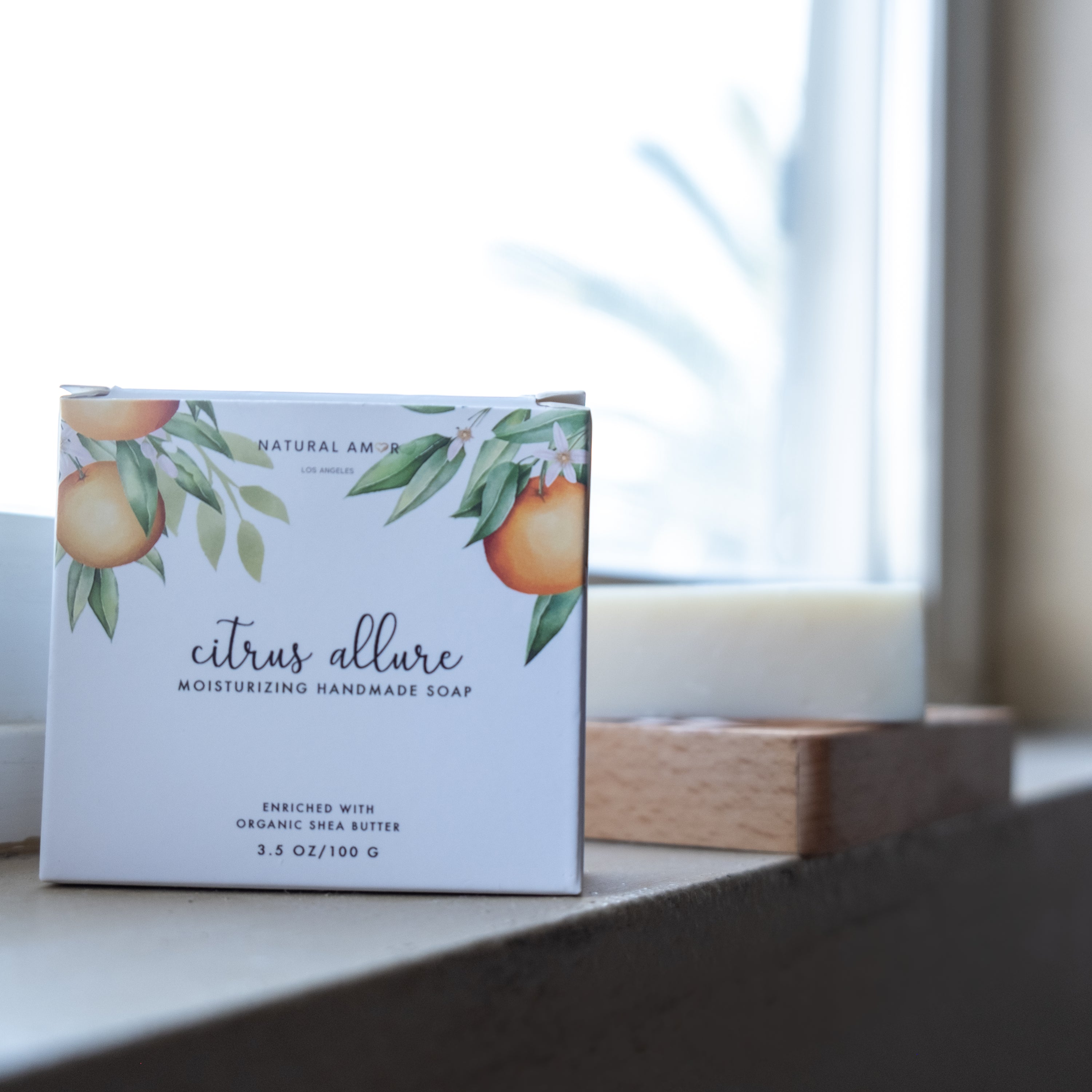 Citrus Allure Soap Bar 3.5oz in a beautifully designed paper box, showcasing its vibrant colors and natural ingredients.